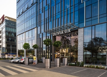 Olivia Business Center with an exotic garden